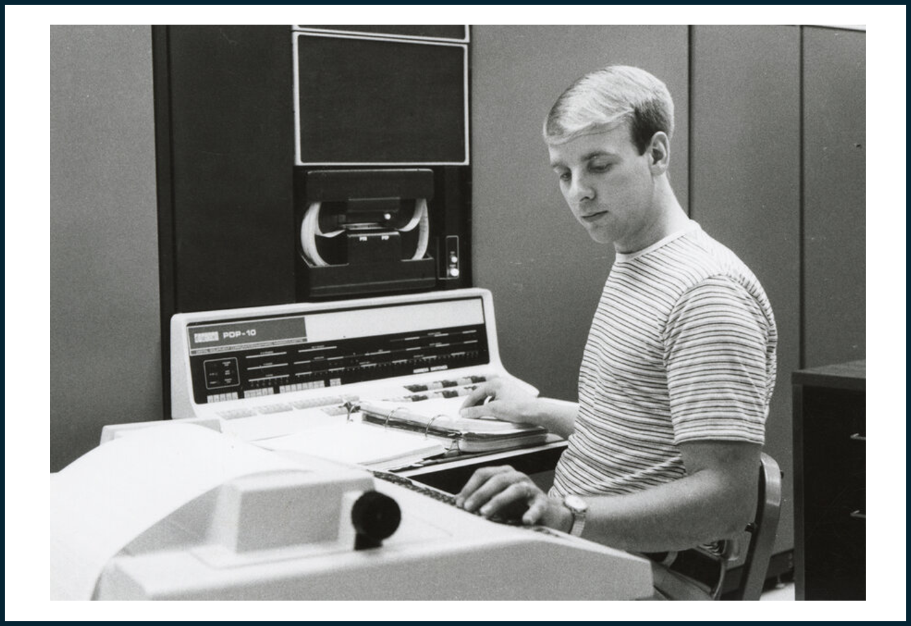 Person sitting in front of computer equipment